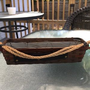 Vintage basket with vinyl striped lining inside.